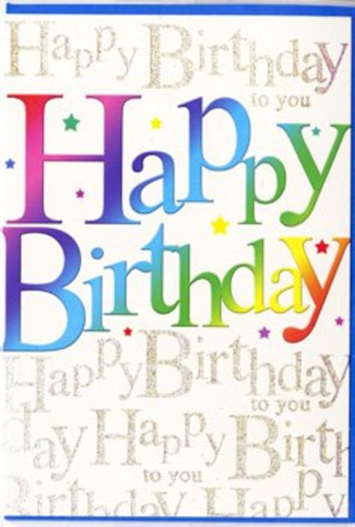 The image shows a jubilant birthday card whose design radiates the same liveliness you might feel walking through Finsbury Park on a sunny weekend. Dominating the front is the phrase Happy Birthday, rendered in big, rounded letters that arc gently across the card like a cheerful banner strung above a party table. Each letter is awash with colour, moving seamlessly from one vivid shade to the next in a soft, rainbow gradient-crimson bleeding into mandarin orange, bright sunshine yellow dissolving into fresh green, then gliding into cool teal and royal blue, before ending in a mellow violet. The overall effect is of letters dipped in liquid colour, glowing warmly against the lighter background. Beneath and behind this bold typography lies a subtle tapestry of golden script. The words Happy Birthday to you are written over and over in a fine, looping hand, spaced evenly so they form a gentle pattern rather than a distraction. The gold appears slightly metallic, catching ambient light in a delicate shimmer, much like evening sunlight glancing off townhouse windows along Stroud Green Road. Tiny specks of light and occasional star-like motifs are sprinkled around the main greeting, suggesting confetti or distant sparklers without overwhelming the design. The surface of the card looks smooth with a hint of sheen, giving the impression of a quality finish you might expect from a thoughtfully chosen card to pair with a birthday bouquet. The combination of vibrant colour, refined script, and subtle sparkle makes this card feel both fun and heartfelt-ideal for slipping alongside flowers delivered to a loved one close to Finsbury Park station or a cosy home near Arsenal's Emirates Stadium.